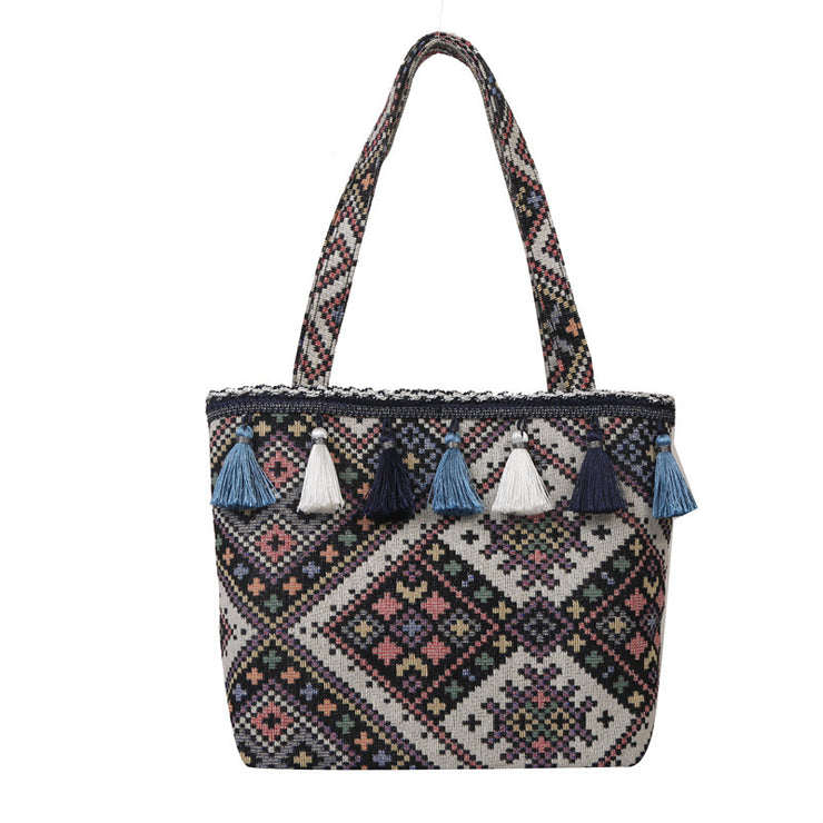 Bohemian Handwoven Tote Bag with Geometric Patterns and Tassel Embellishments