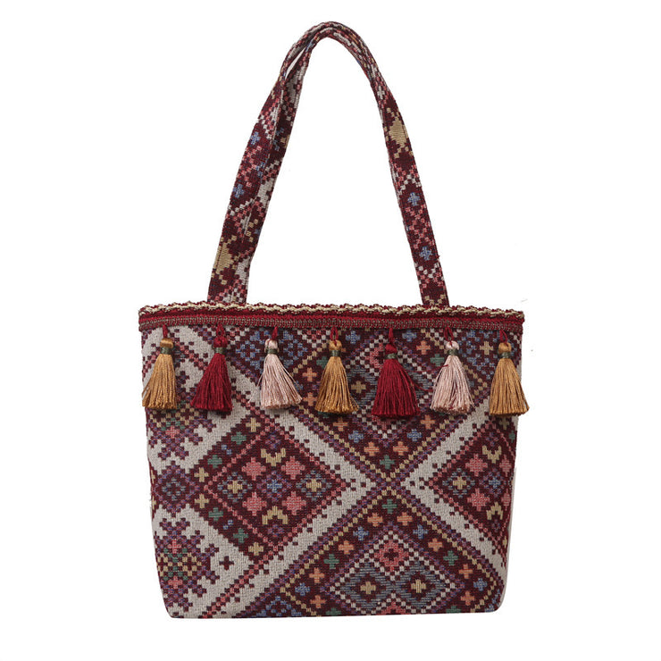 Bohemian Handwoven Tote Bag with Geometric Patterns and Tassel Embellishments